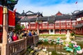 Shanghai, China - May, 2019: Beautiful woman sculpture in the pond of Yuyuan garden in old Shanghai, China. Summer sunny day Royalty Free Stock Photo