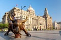 Shanghai, China - May, 2019: Bronze bull on The Bund in Shanghai, Iron bull statue in front of Chinese banks on the Waitan Bund