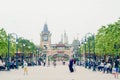 tourists walk around Shanghai Disneyland