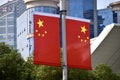 Chinese Flags in Peoples Square, Shanghai, with buildings behind. Shanghai, China, October 25, 2018.