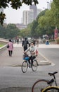 Cyclist in Shanghai with protective mask for pollution