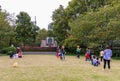 Happy, cheerful families, children & old people playing on the lawn