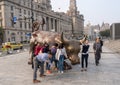 Tourists in front of raging bull on the Bund Shanghai