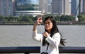 Chinese girl is taking a selfie