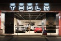 Facade Tesla motors retail store with customers