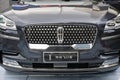 Front of Lincoln Aviator and car logo