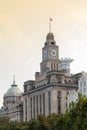 The Customs House located next to The Hong Kong and Shanghai Banking Corporation HSBC Building on the Bund in Shanghai, China Royalty Free Stock Photo