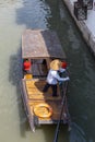 Chinese traditional rowboat sightseeing tour in Zhujiajiao Ancient Water Town, famous tourist destination in Shanghai, China