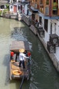 Chinese traditional rowboat sightseeing tour in Zhujiajiao Ancient Water Town, famous tourist destination in Shanghai, China