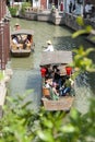 Chinese traditional rowboat sightseeing tour in Zhujiajiao Ancient Water Town, famous tourist destination in Shanghai, China