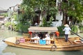 Chinese traditional rowboat sightseeing tour in Zhujiajiao Ancient Water Town, famous tourist destination in Shanghai, China