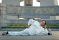 A man exercises and does Tai Chi on the Bund as the sun rises Royalty Free Stock Photo