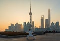 A man exercises and does Tai Chi on the Bund as the sun rises Royalty Free Stock Photo