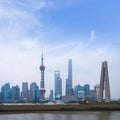 Shanghai high rises office and towers of the Business district skyline at mist behind a pollution haze, across Huangpu river,