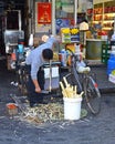 Store owner preparing sugar cane to sell in Shanghai, China 