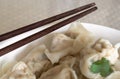 Shanghai style wonton dumplings in bowl Royalty Free Stock Photo