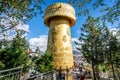 Giant Tibetan Buddhist prayer wheel of Guishan Dafo temple and people view in Dukezong old town in Shangri-La Yunnan China
