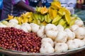 Shank aloo or jicama or sweet turnips are kept with Indian jujube or ber or topa kul in their ripe state at a fruit seller shop in