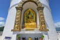 The Shanti Peace Pagoda in Pokhara, Nepal with seated Buddha image in preaching pose and Dharmachakra mudra Royalty Free Stock Photo