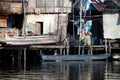 Shanty squatter homes along Philippine river Royalty Free Stock Photo