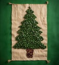 Shape of christmas tree made of coffee beans on wooden table. Top view, copy space. Winter holidays concept