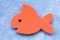 Shape of a fish on a light background. Baby bath toy