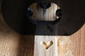 Shape of heart carved on a wood by milling cutter
