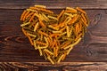 Shape of heart from coloful fusilli pasta.