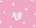 Shape Heart made of rose flower petals and white petals around on pink background. Valentines Day, Mothers Day holiday Royalty Free Stock Photo