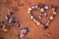 Shape heart from pebble on sand Royalty Free Stock Photo