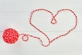 Shape of heart from red woolen thread. Royalty Free Stock Photo