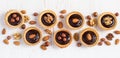 Shape Line small Tarts with chocolate and different nuts White b