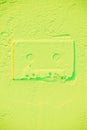 shape of retro audio cassette on light green Royalty Free Stock Photo
