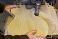 Shape sanding a guitar body Royalty Free Stock Photo