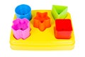 Shape sorter toy with various coloured blocks isolated Royalty Free Stock Photo