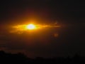 the shape of the sun and clouds looks like a burning eye in the sky Royalty Free Stock Photo