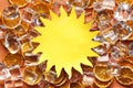 Shape of sun cut out of paper and ice cubes Royalty Free Stock Photo