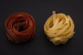 Shaped and colorful pasta in different sizes and colors in  small dishes together at close range. Royalty Free Stock Photo