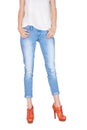 Shapely female legs dressed in blue jeans Royalty Free Stock Photo