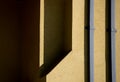 Shapes and Angles Shadows of Yellow Exterior Building Wall Royalty Free Stock Photo