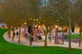 Shapes of people in motion in the Bellevue Downtown Park in the evening Royalty Free Stock Photo