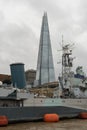 The Shard with museum-ship HMS Belfast in front of it, London, England Royalty Free Stock Photo