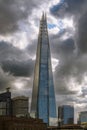 The Shard skyscraper against stormy summer sky in London