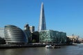 The Shard towers over City Hall and other office buildings alongside the Thames River in London, UK Royalty Free Stock Photo