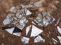 Shards of a broken mirror are scattered on the ground. Environmental pollution. Royalty Free Stock Photo