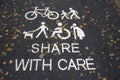 Share with care sign on bicycle and walking path outdoors Royalty Free Stock Photo