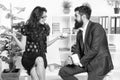 Share coffee with with colleague. Flirting colleagues. Bearded man and attractive woman. Man and woman conversation Royalty Free Stock Photo