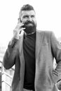 Share information by verbal communication. Bearded man has business talks on smartphone. Business communication skills