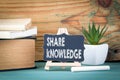 Share knowledge. small wooden board with chalk on the table Royalty Free Stock Photo