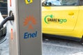 Share`ngo electric car at Enel X charging station Royalty Free Stock Photo